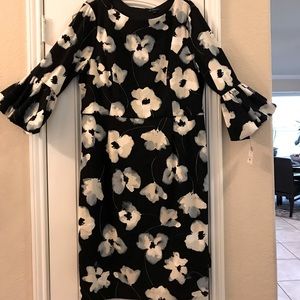 This is a very classy and new w/tag dress Size 18